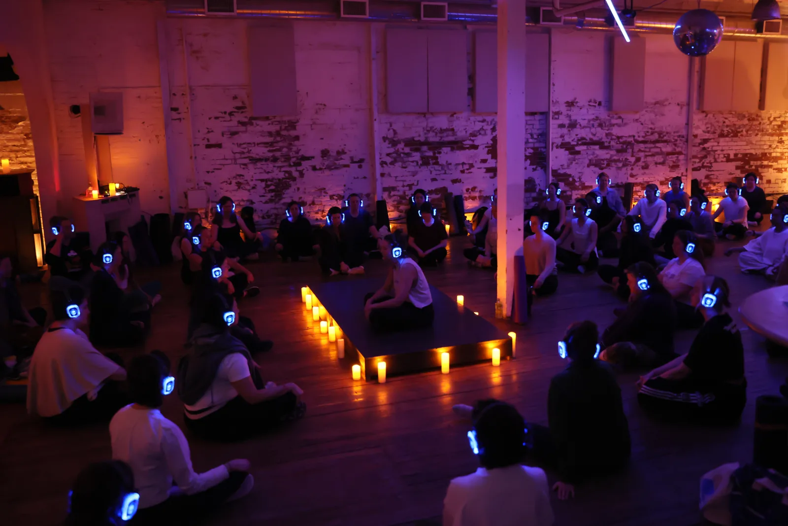 A candlelit circle at a retreat
