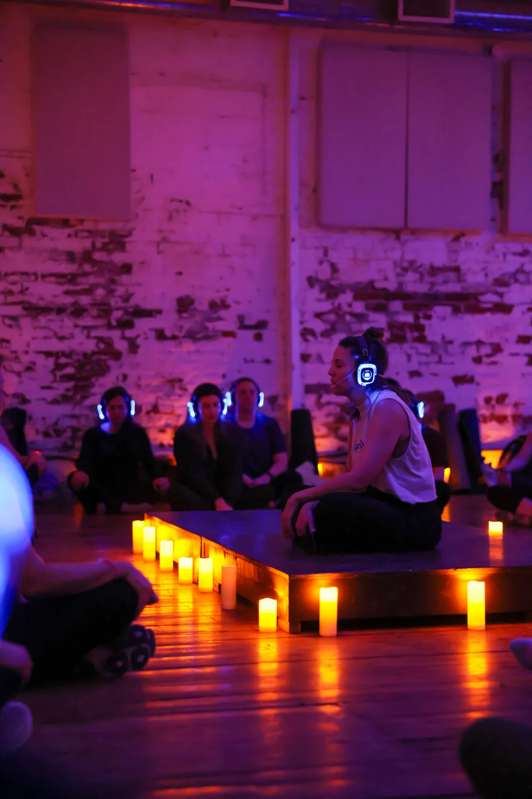 A candlelit circle at a retreat